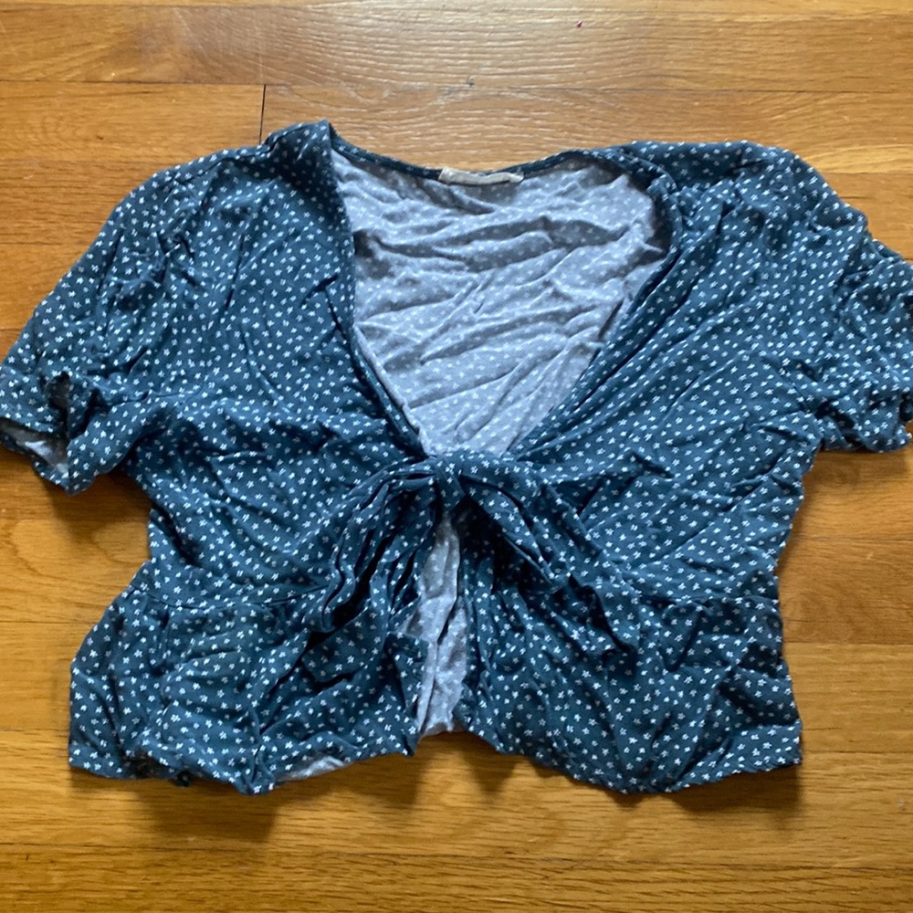 Blue top with white flowers, ties in the front